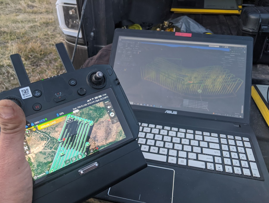 Drone survey data being collected and processed in the field.