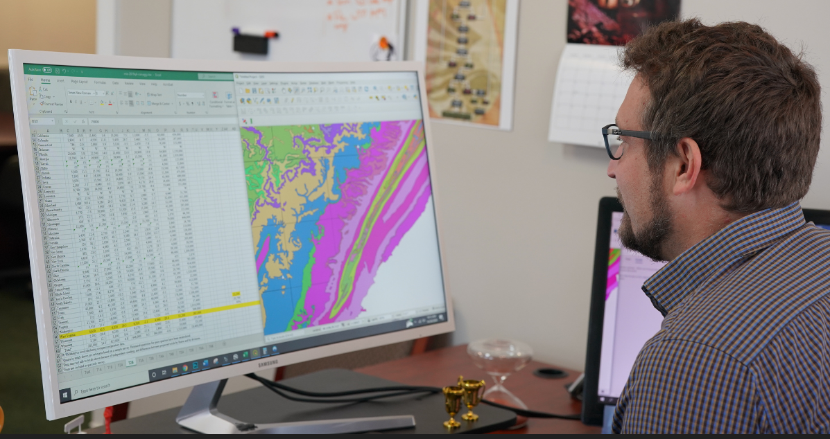 GIS and project data being analyzed for technical evaluation.